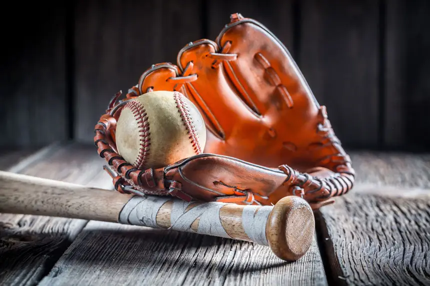 Vintage baseball ball and golden glove